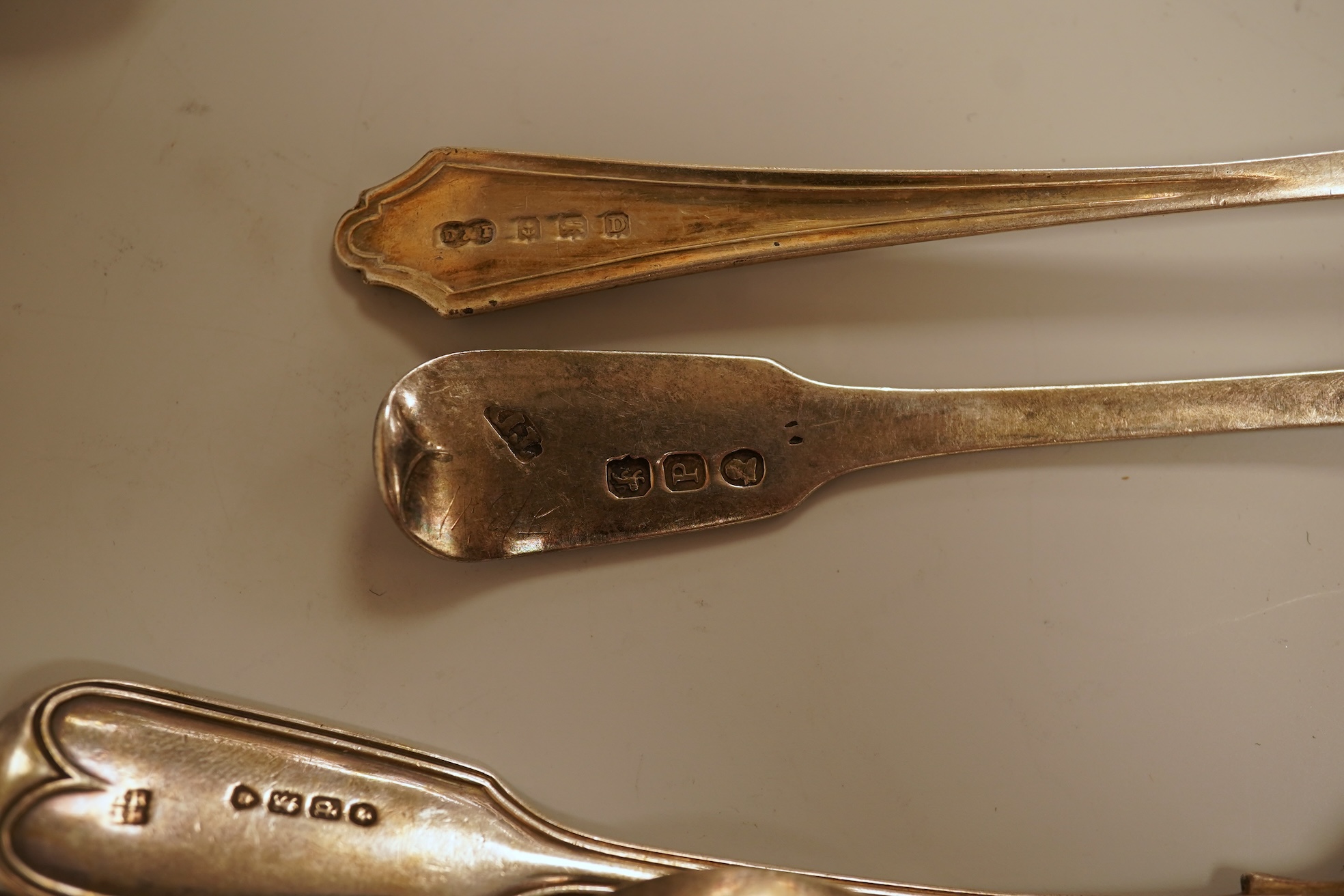 A small quantity of 18th century and later assorted silver teaspoons, various patterns, dates and makers, together with a George V silver pastry fork and two George V silver caddy spoons, 10.7oz.